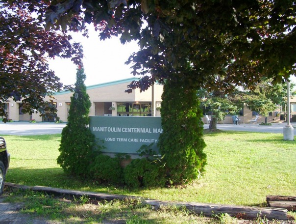 Centennial Manor sign and landscaped grounds